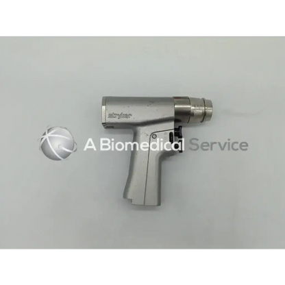 Stryker endoscopy 6205 system dual trigger rotary surgical drill with metallic silver body and black trigger rotary mechanism