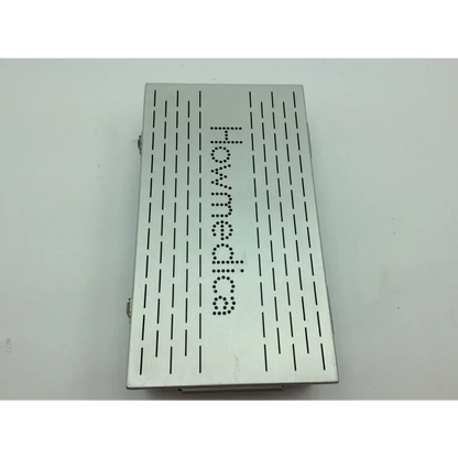 Silver metallic stryker howmedica storage case with perforated design and hommedics embossed lettering