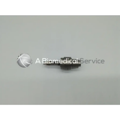 Black metallic medical component of stryker hudson modified trinkle 6203-135-000 device shown from the back side