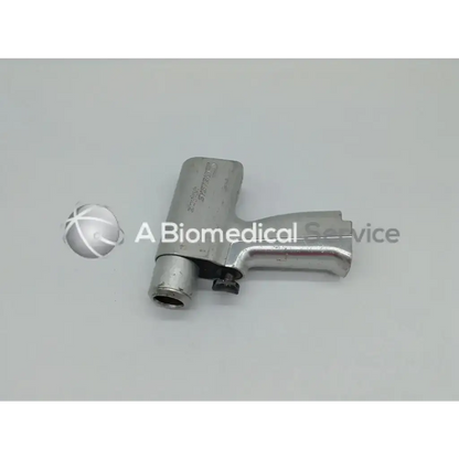 Silver metallic stryker system 5 double trigger rotary drill with handle and cylindrical attachment for surgical use