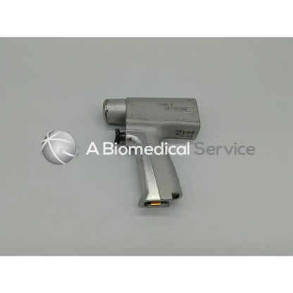 Silver metallic stryker system 5 double trigger rotary drill with textured grip and engraved branding for surgical use
