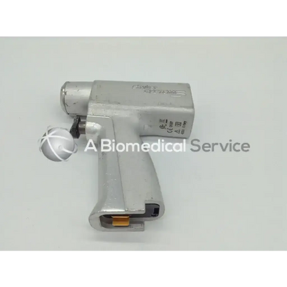 Silver stryker system 5 double trigger rotary drill handpiece with textured grip and metallic finish