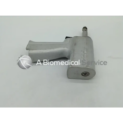 Silver metallic orthopedic reciprocating impact wrench with ergonomic grip and threaded connection port for stryker system 5