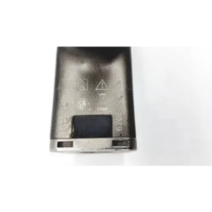 Back side of silver-colored matte finished stryker system 6 sagittal saw 6208 with embossed symbols on aluminum casing