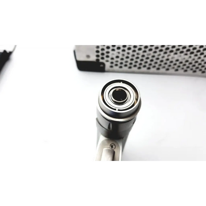 Black and silver stryker system 7 large bone battery powered drill with polished metallic finish handpiece