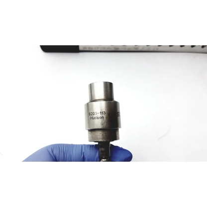 Silver metallic cylindrical tool with engraved 6203-113 hudson for stryker system 7 large bone battery powered drill