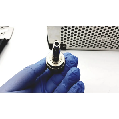 A metallic cylindrical ball joint with polished chrome finish and black rubber seal for stryker system 7 large bone battery powered drill set