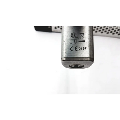 Silver metallic cylindrical large bone battery powered drill with engraved certification marks and base indentation
