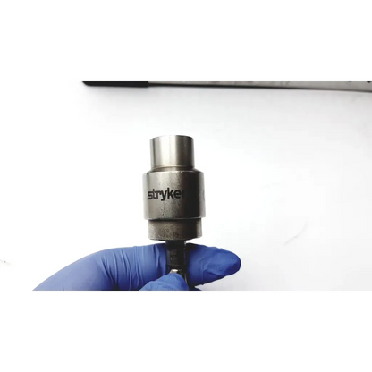 Silver metallic stryke brand impact wrench socket with machined surface for large bone battery powered drill use