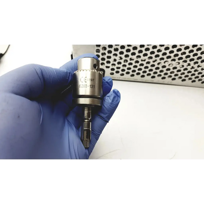 Silver metallic stryker system 7 large bone battery powered drill handpiece with textured grip and engraved markings