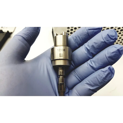 Metallic cylindrical diesel fuel injector nozzle with machined finish and part number 12108 for bone battery powered drill