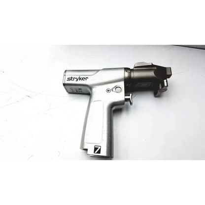 Silver stryker system 7 large bone battery powered drill set with sleek ergonomic design and black head accents