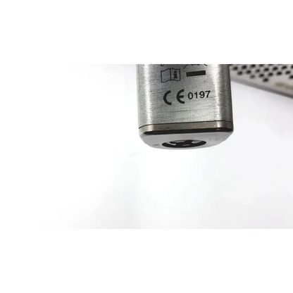 Silver cylindrical lock with brushed metal finish and engraved markings for stryker system 7 large bone battery powered drill