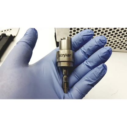 Metallic stryker large bone battery powered drill with cylindrical body and multiple protruding tips for surgical use