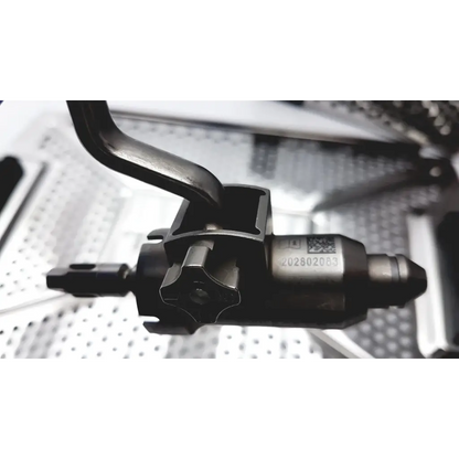 Black metal engine valve spring compressor with hexagonal handle and engraved serial number for bone battery powered drill use
