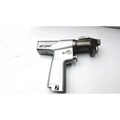Silver stryker battery powered drill with textured grip and black metallic head for large bone use