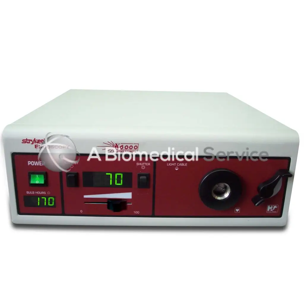 Stryker x6000 white and red electrosurgical unit with digital display showing green numbers and 300 watt xenon light source