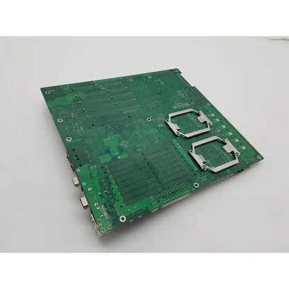 Green super micro x6dh8-xg2csi main board with silver metallic heat sinks and multiple ports along its edge