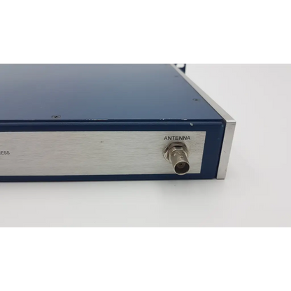 Blue and silver symmetricom truetime nts-200 network time server with bnc antenna connector labeled antenna on side panel