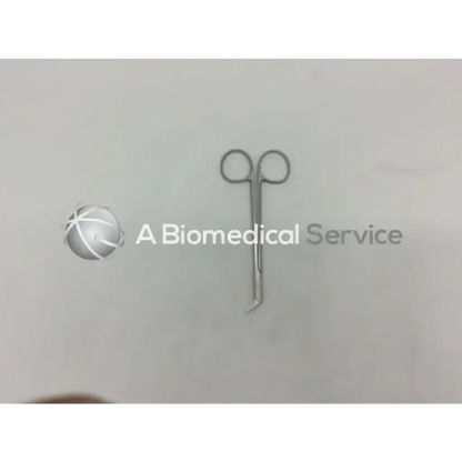 Metallic surgical potts smith scissors with curved pointed tips and circular handles for precise surgical use