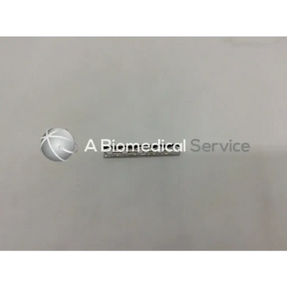 Silver metallic biomedical logo with stylized globe emblem on synthes 241.35 one-third tubular plate with collar 5 holes