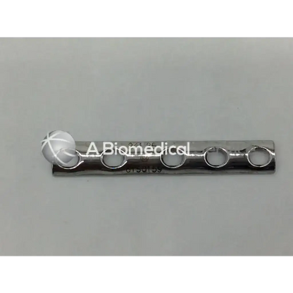 Silver-colored metallic one-third tubular plate with four circular holes and spherical end cap from Synthes 241.35