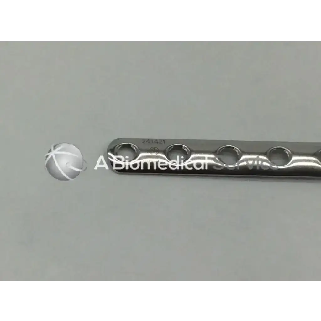 Silver metallic Synthes 241.421 LCP one third tubular plate with collar and 12 evenly spaced holes 141mm long