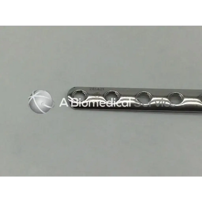 Silver metallic Synthes 241.421 LCP one third tubular plate with collar and 12 evenly spaced holes 141mm long