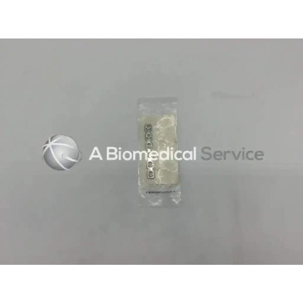A set of five metallic circular dental implants in clear plastic packaging for synthess 3.5mm reconstruction plate