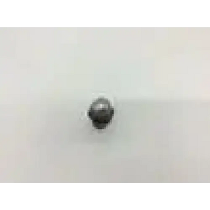 A small round metallic button with textured surface on the synthes 311.023 ratcheting driver handle us568