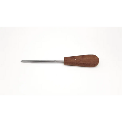 Wooden-handled Synthes 314.27 large hexagonal driver with polished metal shaft for precise surgical use