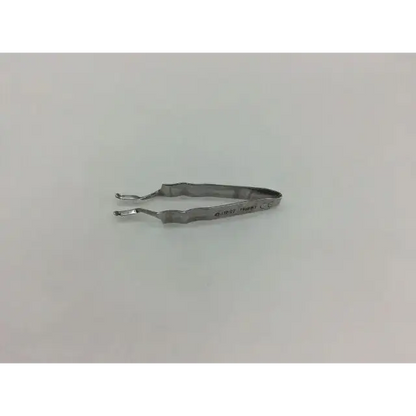 Silver-colored metal synthes 319.97 forceps with textured wavy handle design for precise gripping and handling
