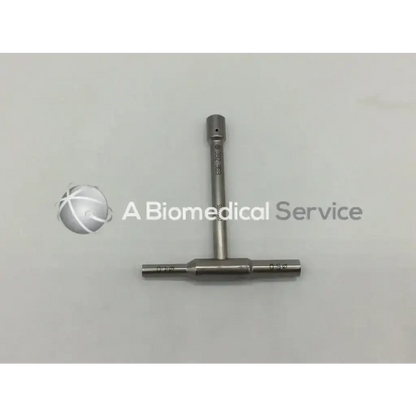 Silver metallic t-shaped synthes 392.969 combination wrench 4mm with engraved markings on shaft and crossbar