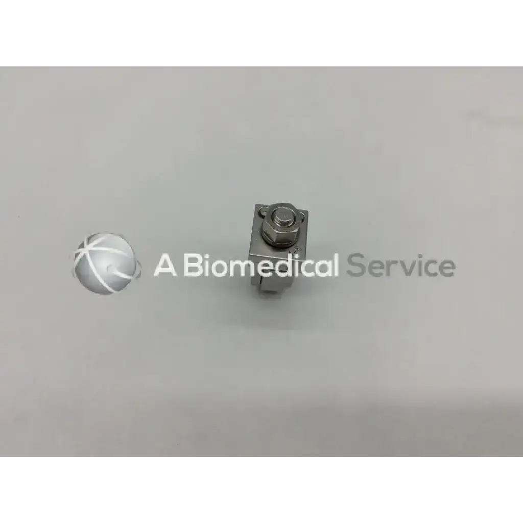 Silver metallic Synthes 393.64 external fixation adjustable clamp orthopedic with hexagonal head and rectangular body