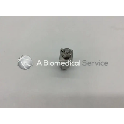 Silver metallic Synthes 393.64 external fixation adjustable clamp orthopedic with hexagonal head and rectangular body