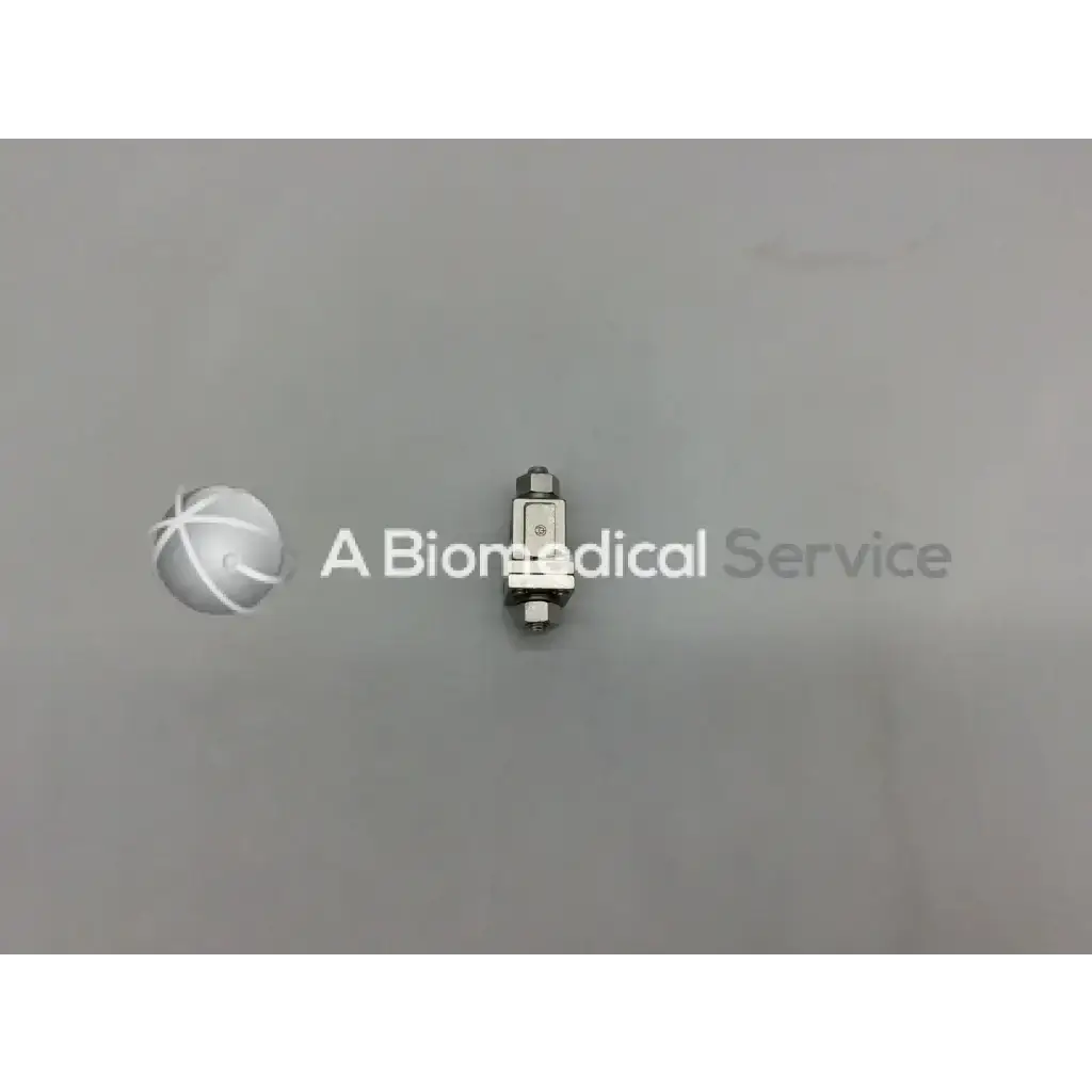 Silver metallic external fixation adjustable clamp with threaded ends and engraved markings for orthopedic use