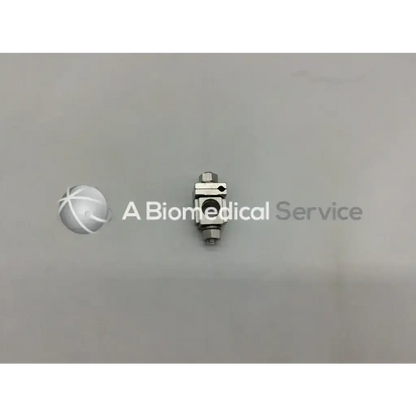 Silver metallic external fixation adjustable clamp with rectangular body and threaded ends for orthopedic use synthes 393.64