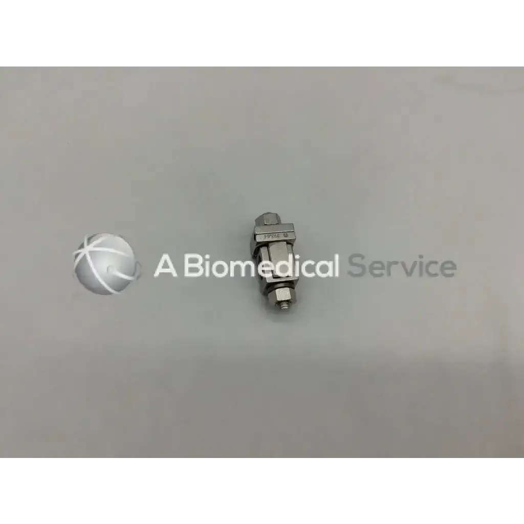 A metallic silver syntheses 393.64 external fixation adjustable clamp orthopedic with hexagonal head and threaded ends