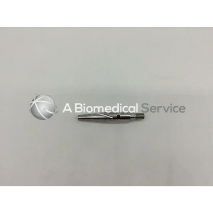 Silver synthes bolt conical surgical drill bit with threaded shaft and engraved markings for universal tibial nails