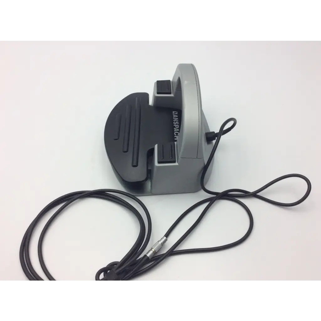 Gray and black danschot mouse rest with coiled black cable for synthes electric pen drive console in neurosurgery drill use