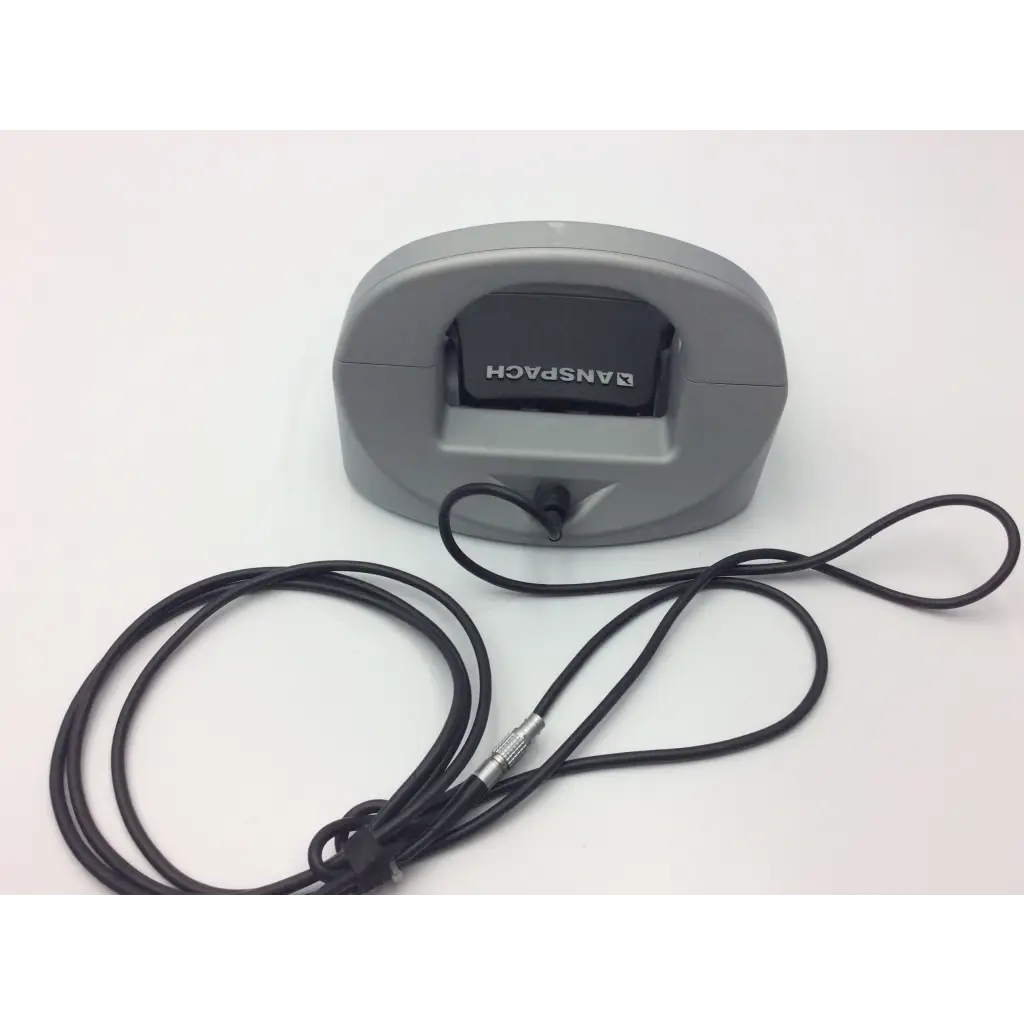 Gray plastic synthes electric pen drive console with black cable and metallic connector for neurosurgery drill use
