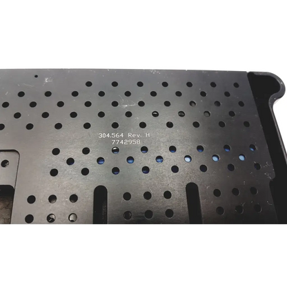 Black perforated metal tray with stamped serial number from synthes mini external fixation set 304-564 rev h