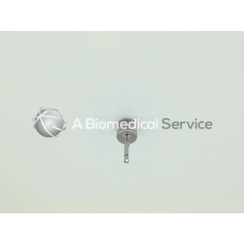 Silver surgical implant with spherical head and threaded shaft from synthes swiss colibri 532.031