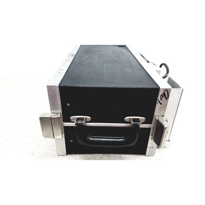 Black hard-shell flight case with silver aluminum edges and rubberized handle for systron donner mrc 6500 microwave repeater test set