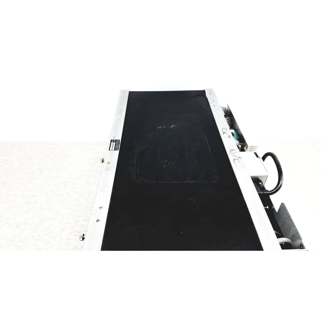 Black conveyor belt with silver metallic side rails and mechanical components of systron donner mrc 6500 microwave repeater test set