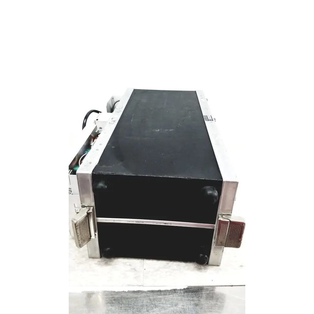 Black rectangular systron donner mrc 6500 microwave repeater test set with silver edges and side ventilation grilles