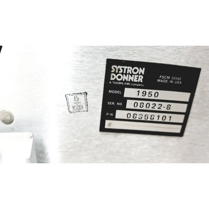 Black label with white text identifying systron donner model 1950 made in usa on microwave repeater test set back panel