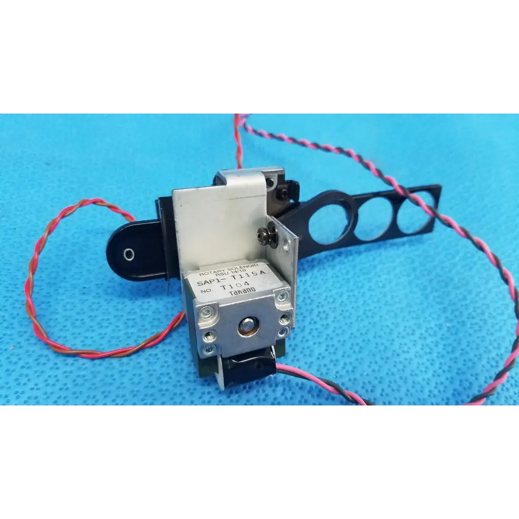 Silver and black takano sap1-t115a rotary solenoid optical lens filter slider with red and pink wiring for retinal camera