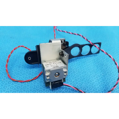 Silver and black takano sap1-t115a rotary solenoid optical lens filter slider with red and pink wiring for retinal camera