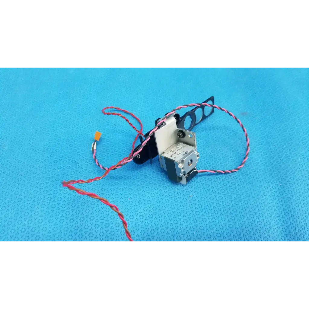 Silver and black Takano SAP1-T115A rotary solenoid optical filter slider with red-and-white striped wires for retinal camera